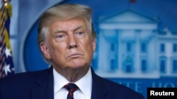 FILE - U.S. President Donald Trump listens to a question as he answers reporters questions during a news conference at the White House in Washington, Sept. 4, 2020.