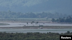 People are seen on Myanmar side, during ongoing conflict in Rakhine state of Myanmar, in Teknaf area of Cox's Bazar