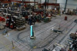 A ZenZoe Robot disinfects a factory with ultraviolet light in Madrigalejo del Monte, near Burgos, Spain, May 12, 2020.