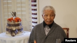 In this file photo, former South African president Nelson Mandela is shown observing his 94th birthday at his house in Qunu, Eastern Cape, July 18, 2012.