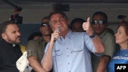 FILE - Brazilian President Jair Bolsonaro delivers a speech during a demonstration in his support in Sao Paulo, Brazil, on Sept. 7, 2021, on Brazil's Independence Day.