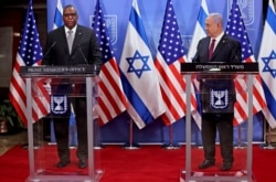 U.S. Defense Secretary Lloyd Austin and Israeli Prime Minister Benjamin Netanyahu give a statement after their meeting in Jerusalem on April 12, 2021.