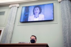 Sen. Gary Peters, D-Mich., questions nominee for Secretary of Commerce, Gina Raimondo, during her Senate Commerce, Science, and Transportation Committee confirmation hearing, Jan. 26, 2021, on Capitol Hill in Washington.