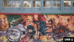 জাতিসংঘ মানবাধিকার বিষয়ক হাইকমিশনারের প্রতিবেদনের প্রচ্ছদে গত বছর জুলাই-অগাস্ট মাসে সরকার-বিরোধী বিক্ষোভের এক দেয়াল অঙ্কন। 