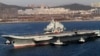 FILE - Chinese aircraft carrier Liaoning cruises back to port after its first navy sea trial in Dalian, northeastern China.
