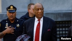 FILE - Actor and comedian Bill Cosby exits the Montgomery County Courthouse after a jury convicted him in a sexual assault retrial in Norristown, Pennsylvania, April 26, 2018.