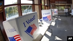 Early election ballot completion area is prepared at a collection location at the North Park Ice Skating Rink Lodge area, Oct. 9, 2020, in McCandless, Pa. 
