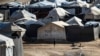 FILE - Children play among tents at the Kurdish-run al-Hol camp, which holds suspected relatives of Islamic State group fighters, in the northeastern Syrian Hasakeh governorate, Feb. 17, 2021.