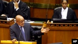 FILE - South African President Jacob Zuma answers questions from opposition party members during a parliamentary session in Cape Town, South Africa, March. 17, 2016. On Tuesday, Zuma survived a move by his own party to oust him as president.