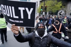 People celebrate after a guilty verdict was announced at the trial of former Minneapolis police Officer Derek Chauvin for the 2020 death of George Floyd, April 20, 2021, in Minneapolis, Minn.