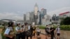 Riot police stand guard as protesters walk outside the Legislative Council in Hong Kong, June 13, 2019. 
