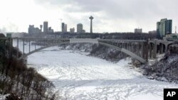 FILE - The Rainbow Bridge crosses over the Niagara gorge into Niagara Falls, Ontario, Canada as seen from Niagara Falls, N.Y.