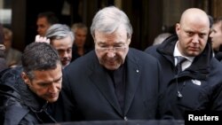 FILE - Australian Cardinal George Pell leaves at the end of a meeting with the victims of sex abuse, at the Quirinale hotel in Rome, Italy, March 3, 2016.