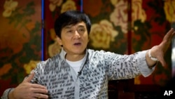 FILE - Action star Jackie Chan speaks during an interview in Beijing, Aug. 3, 2015. 