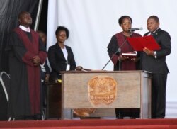 Mozambique's President Filipe Nyusi, right, during his inauguration ceremony in Maputo, Mozambique,Jan. 15, 2020. Nyusi has been sworn in for a second and final term after five turbulent years in office amid two armed insurgencies.