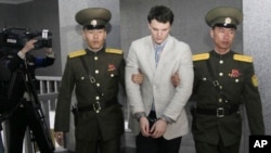 FILE - American student Otto Warmbier, center, is seen here at the Supreme Court in Pyongyang, North Korea, Wednesday, March 16, 2016. (AP Photo/Jon Chol Jin)