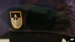 FILE - A "green beret" is seen at the John F. Kennedy Library and Museum in Boston. A former U.S. Army Special Forces officer who served in the Green Berets pleaded guilty Nov. 18, 2020, to charges of providing military information to Russian agents.