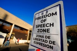 Zoned areas for protesters divide the parking lot of the Maricopa County Recorder's Office, in Phoenix, Nov. 5, 2020.