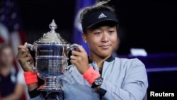 Naomi Osaka of Japan holds the U.S. Open trophy after beating Serena Williams of the USA in the women’s final of the 2018 U.S. Open tennis tournament at the USTA Billie Jean King National Tennis Center in New York, Sept, 8, 2018. (R. Deutsch/USA Today)