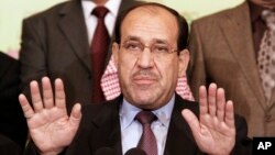 FILE - Iraqi Prime Minister Nouri al- Maliki speaks to the press in Baghdad, Iraq.