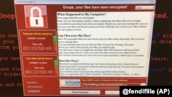 This image provided by the Twitter page of @fendifille shows a computer at Greater Preston CCG as Britain’s National Health Service is investigating “an issue with IT,” May 12, 2017. Hospitals, businesses and organizations around the world reported proble
