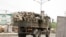 FILE - Soldiers are seen on a truck along a road in Maiduguri in Borno State, Nigeria.