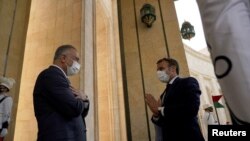 Iraqi Prime Minister Mustafa al-Kadhimi meets with French President Emmanuel Macron in Baghdad, Iraq, Sept. 2, 2020.