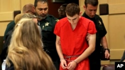 FILE - Nikolas Cruz appears in court for a status hearing before Broward Circuit Judge Elizabeth Scherer, Feb. 19, 2018, in Fort Lauderdale, Florida.