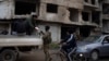Syrian security forces search for pro-Assad militants in Homs, state media say