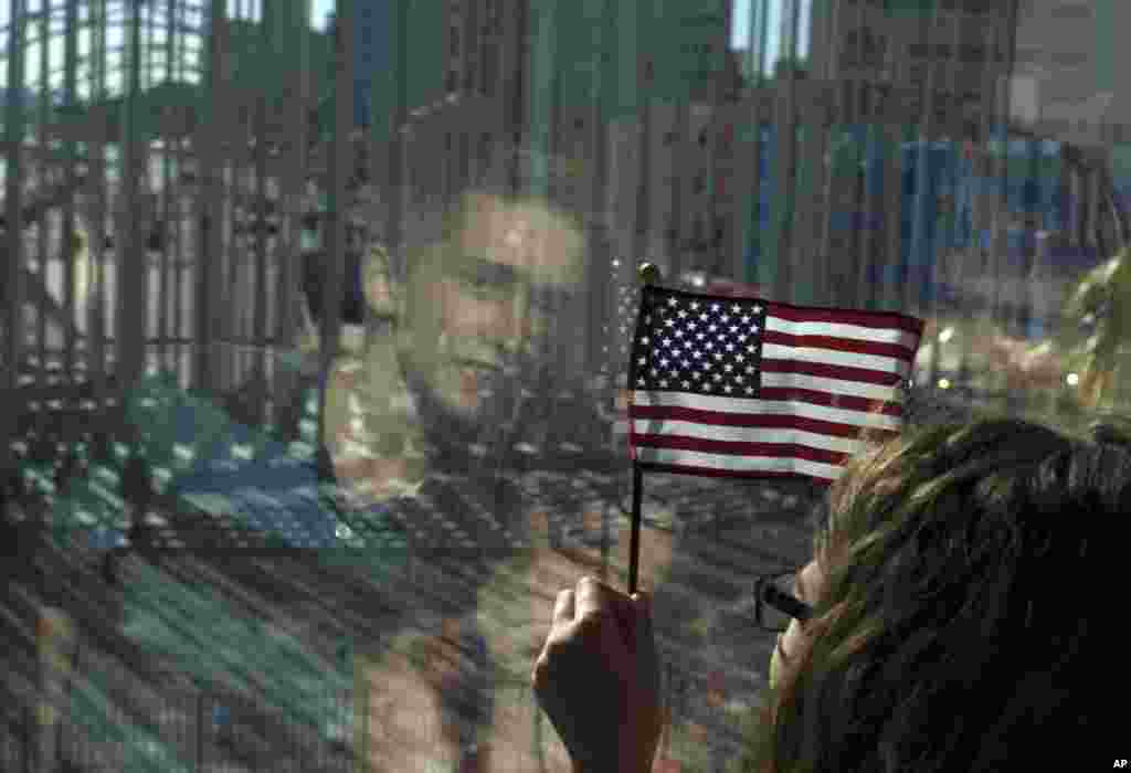 Family members of U.S. Embassy employees look out at the staging area before the start of a flag raising ceremony, at the newly opened U.S. Embassy, in Havana, Cuba, Aug. 14, 2015.