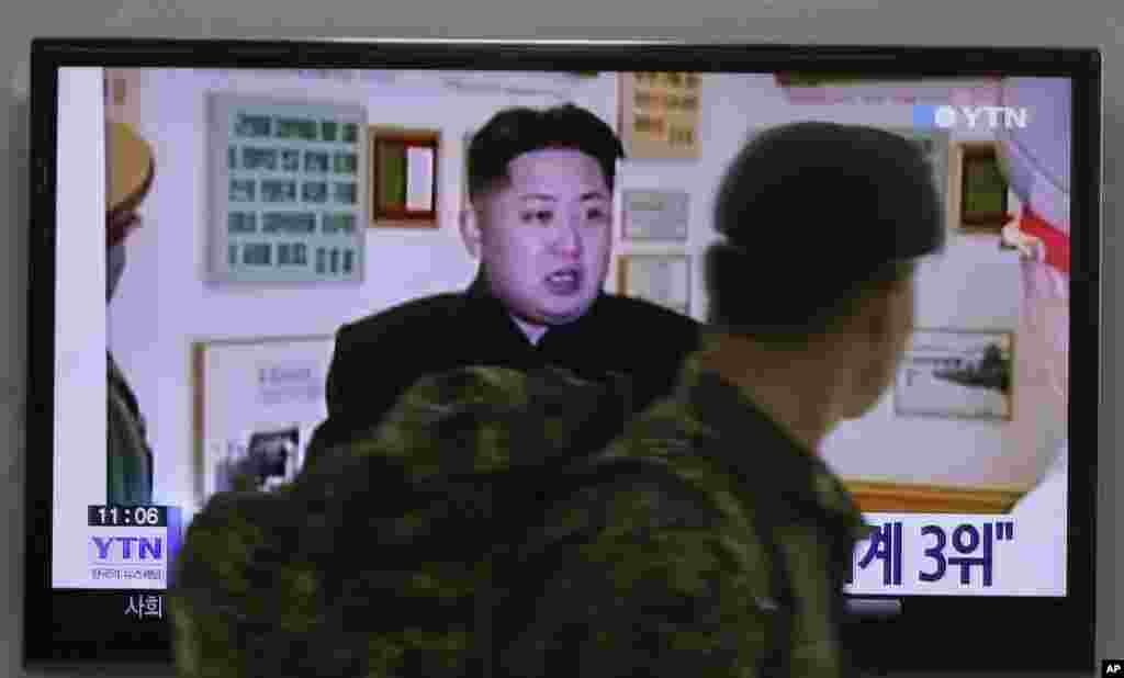 A South Korean army soldier watches a TV news program showing North Korean leader Kim Jong Un, at the Seoul Railway Station in Seoul, South Korea, Dec. 22, 2014.