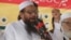 Hafiz Saeed, leader of Jamaat-ud-Dawa address an anti-Indian rally in Lahore, Pakistan, Sept. 30, 2016. 