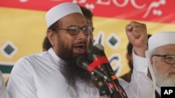 FILE - Hafiz Saeed, leader of Jamaat-ud-Dawa address an anti-Indian rally in Lahore, Pakistan. 
