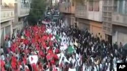 An image grab from footage uploaded on YouTube made available on September 18, 2011, shows a protest by Syrian students on the first day of school in the flashpoint city of Homs.