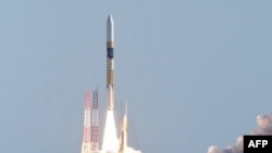  FILE - A rocket carrying a small lunar surface probe and other objects lifts off from the Tanegashima Space Centre on Tanegashima island, Kagoshima prefecture on Sept.7, 2023. Japan's "Moon Sniper" spacecraft will attempt a historic touchdown on the lunar surface this weekend.