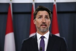 Canadian Prime Minister Justin Trudeau speaks to the press, Jan. 9, 2020, in Ottawa, Canada. He said Canada had intelligence from multiple sources indicating that a Ukrainian airliner that crashed near Tehran was mistakenly shot down by Iran.