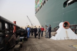 Oussama Rabieh, chairman of the Suez Canal Authority, monitors the situation near the stranded container ship Ever Given after it ran aground, in Suez Canal, Egypt, March 25, 2021. (Suez Canal Authority/Handout via Reuters)