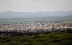 FILE - A general view shows Khan Sheikhoun in the southern countryside of Idlib, in March 2015.