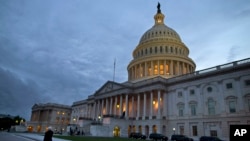 FILE - A view of the U.S. Capitol building is shown at dusk in Washington, October 2013.