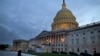 FILE - A view of the U.S. Capitol building is shown at dusk in Washington, October 2013.