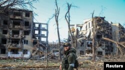 A service member from Chechen Republic looks on during fighting in Ukraine-Russia conflict in Mariupol