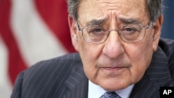 Defense Secretary Leon Panetta participates in a news conference at the Pentagon, Jan. 24, 2013, where he announced he is lifting a ban on women serving in combat. 