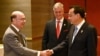U.S. Secretary of Commerce Wilbur Ross shakes hands with China's Premier Li Keqiang, as U.S. National Security advisor Robert O'Brien watches, as they attend a bilateral meeting on the sidelines of the 35th ASEAN Summit in Bangkok, Nov. 4, 2019.