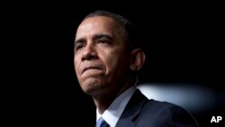 President Barack Obama pauses while speaking at the LBJ Presidential Library, April 10, 2014, in Austin, Texas.