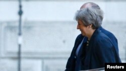 Britain's Prime Minister Theresa May arrives at Downing Street in London, Britain, Oct. 22, 2018. 