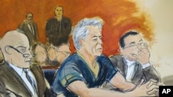 In this courtroom artist's sketch, defendant Jeffrey Epstein, center, sits with attorneys Martin Weinberg, left, and Marc Fernich during his arraignment in New York federal court, Monday, July 8, 2019.