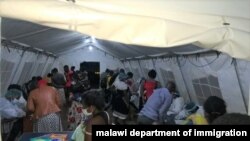 Malawi returnees screened at Mwanza border upon arrival from South Africa. (Courtesy: Pasqually Zulu/Immigration Departmentment)