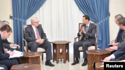 Syria's President Bashar al-Assad (CR) meets Russian deputy Foreign Minister Sergei Ryabkov (CL) in Damascus, Sept. 18, 2013.