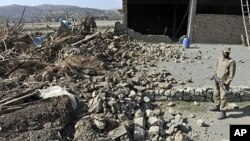 A Pakistani soldier stands on the premises of a destroyed Taliban militant training centre in Sararogha town, which was stronghold of Taliban militants in troubled South Waziristan, on November 17, 2009