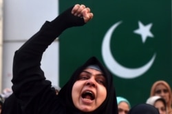 A protester shouts slogans against the United States during a demonstration following a US airstrike that killed top Iranian commander Qasem Soleimani in Iraq, in Lahore on Jan. 3, 2020.